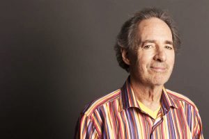 Harry Shearer is wearing a cool striped shirt